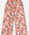 A pair of wide-leg cropped pants for kids, featuring a pink base color with an all-over strawberry print in brown, cream, and dark green, displayed flat against a light gray background.