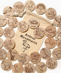 Wooden discs with animal illustrations and movements on a white background