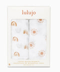 Packaged cotton muslin blankets with rainbow and sun patterns, brand 'lulujo' visible.