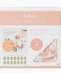 Lulujo baby product package with peach-themed design on a white background