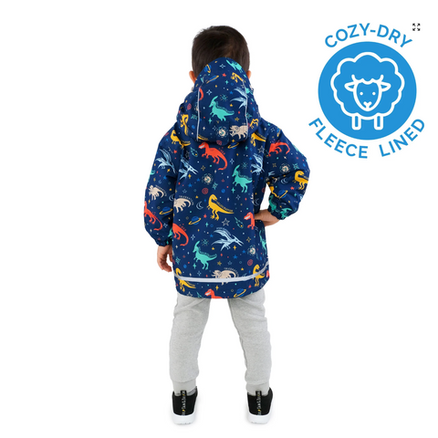 Child wearing a colorful dinosaur-patterned raincoat with a Cozy-Dry fleece-lined label on a white background.