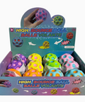 Box of high bounce balls with colorful design on a white background