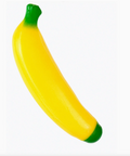 A yellow banana-shaped squishy toy with green stem and tip, shown on a plain white background.
