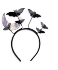 Black bat-themed headband with multiple black bat silhouettes and a metallic lavender-purple crescent moon decoration, shown on a plain white background.