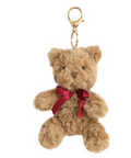 Plush teddy bear keychain with a red ribbon on a white background