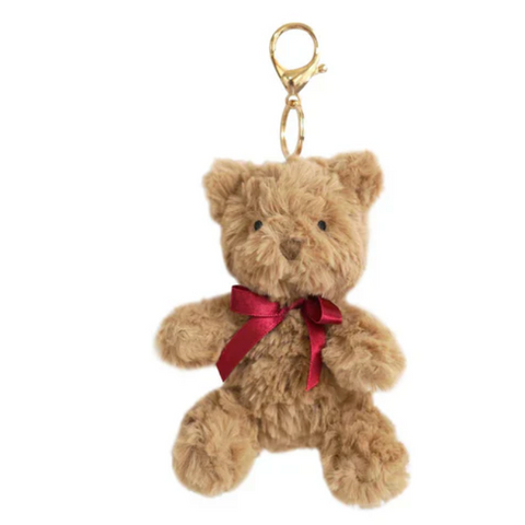 Plush teddy bear keychain with a red ribbon on a white background
