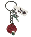 Keychain with red flower charm and 'JAN' tag on a light gray background