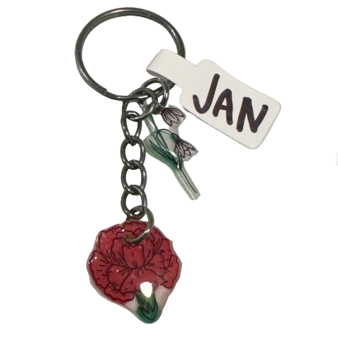 Keychain with red flower charm and 'JAN' tag on a light gray background