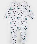 A baby footed sleeper in white with an all-over berry print, featuring dark purple berries and green leaves, laid flat on a light background.