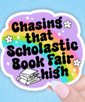 Sticker with 'Chasing that Scholastic Book Fair high' text on a colorful background