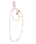 A pastel beaded necklace with daisy flowers and two small heart charms, shown on a white background with a product tag attached.