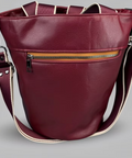 burgandy coloured tote bag with zipper pouch on front and shoulder straps