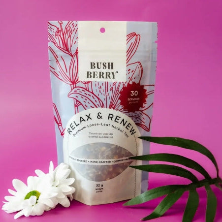 Herbal tea packaging with 'Bush Berry' branding on a pink background