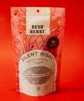 Tea package labeled 'Silent Night' by 'Bush Berry' on a red background