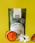 Packaging of 'Throat Soothe' with dried berries and a flower on a yellow background