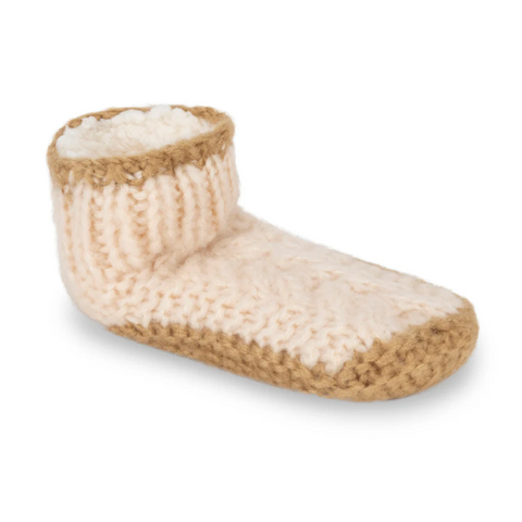 Knitted slipper with fur lining on a white background