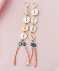 Set of hair accessories on a branded card on a wooden surface