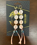Set of hair accessories on a branded card on a wooden surface