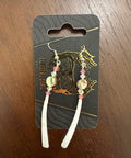Decorative hair clip on a branded card with a dark background