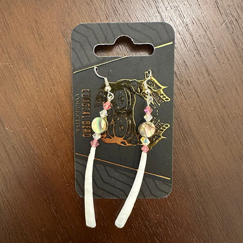 Decorative hair clip on a branded card with a dark background