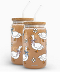 Two glass jars with wooden lids featuring duck illustrations on a white background