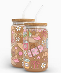 Two glass jars with wooden lids featuring colorful illustrations on a white background