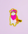 Sticker of a cat wearing a pink hat and bandana on a light purple background