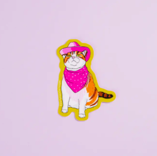 Sticker of a cat wearing a pink hat and bandana on a light purple background