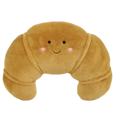 Plush pillow shaped like a brown bread roll with a face on a white background