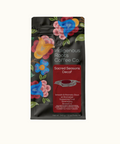 Indigenous Roots Coffee Co. coffee package with colorful floral designs on a white background