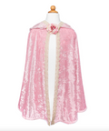 A pink velvet cape with beige lace trim and a pink fabric rose at the neckline, displayed on a white mannequin torso against a plain white background.
