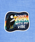 Sticker with a bird design and text 'Don't F**k with my vibe' on a blue textured background