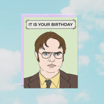 Card with a cartoon character's face and 'It is your birthday' text on a blue sky background.
