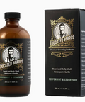 Brown bottle and black box of 'Educated Beards' beard and body wash with branding and product details.