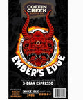 Coffin Creek Coffee Co. Ember's Edge coffee package with a red demon-like face design on a black background.