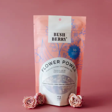 Flower Power tea package with pink roses on a pink background
