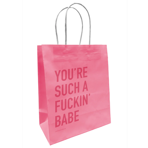 Pink shopping bag with text on a white background