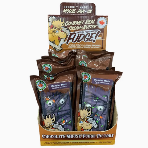 A retail display box filled with individually wrapped packages of Monster Mash chocolate fudge from the Chocolate Moose Fudge Factory, shown against a plain white background.