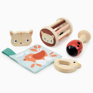 Set of baby toys including a rattle, teether, and soft book on a white background
