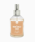 Clear spray bottle labeled 'Warm Vanilla Sugar' on a white background