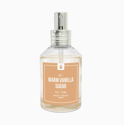 Clear spray bottle labeled 'Warm Vanilla Sugar' on a white background