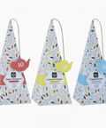 Three triangular tea bags with colorful labels on a white background