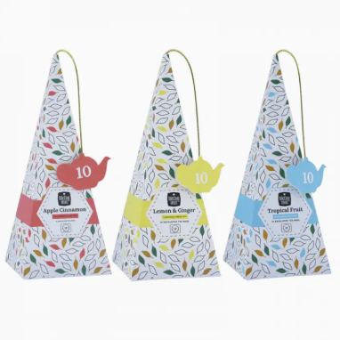 Three triangular tea bags with colorful labels on a white background