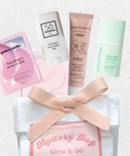 Mystery bag with skincare products and a pink ribbon on a light background