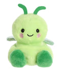 Green plush toy with a smiling face on a white background