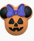An orange pumpkin-shaped sponge or bath bomb decorated like Minnie Mouse's head, featuring a purple bow, black ears, and a black jack-o'-lantern face, shown on a plain white background.