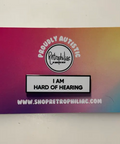 Colorful card with 'Proudly Autistic' and 'I AM HARD OF HEARING' text on a gradient background.