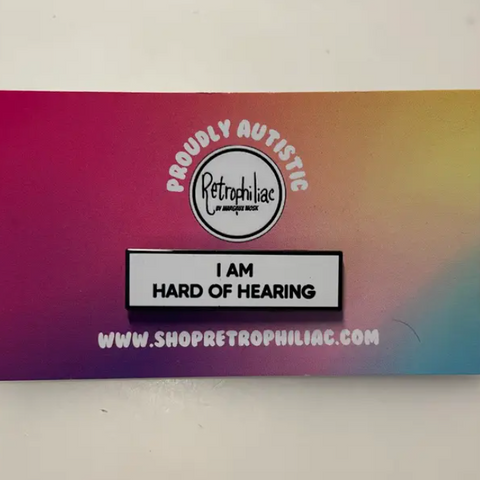Colorful card with 'Proudly Autistic' and 'I AM HARD OF HEARING' text on a gradient background.