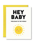 Greeting card with 'Hey Baby Welcome to the World' text and a sun illustration on a white background.