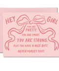 Pink card with a bow design and text on a white background